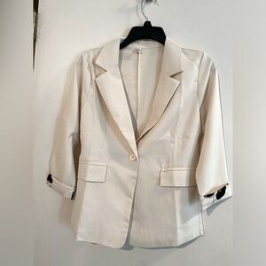 Cute Blazer with decorated 3/4 sleeve.